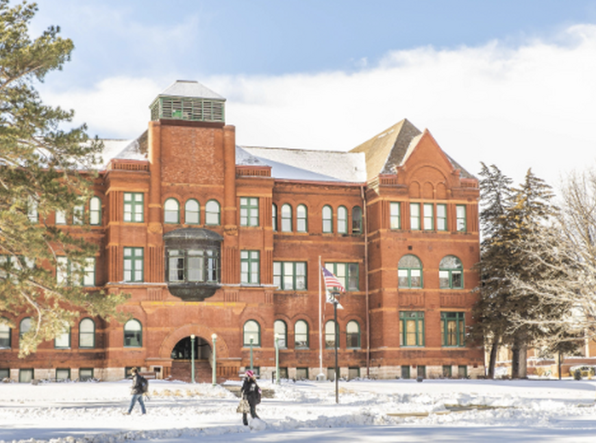 Snowy photo of Old Main.